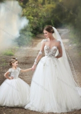 Feminine See Through Long Sleeves Luxurious Wedding Dresses with Appliques and Lovely Big Puffy Flower Girl Dress with Hand Made Flowers